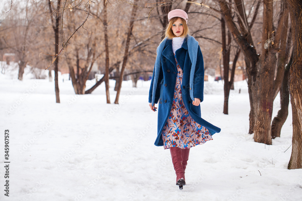 Portrait of a young beautiful woman in winter park Portrait of a young beautiful woman in winter park