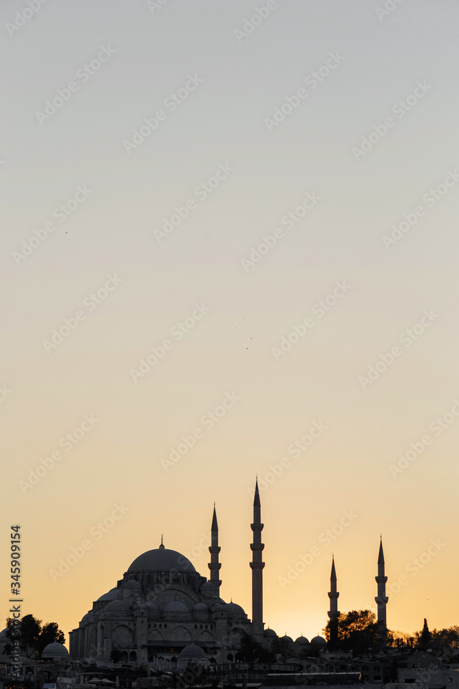 Silhouette of a mosque with minarets at sunset in Istanbul
