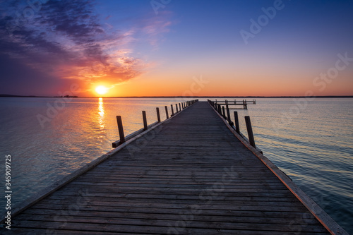Fototapeta Naklejka Na Ścianę i Meble -  Beautiful romantic sunset over a calm lake