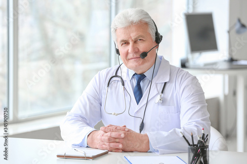 Male doctor giving a consul...