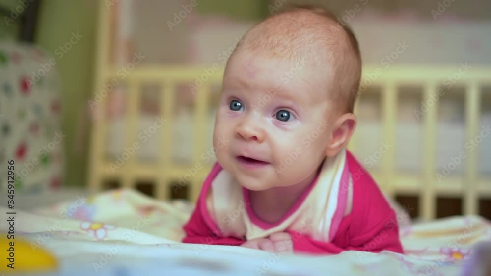 Cute baby infant in bed smiling. Beautiful baby. Cute baby infant in bed smiling. Beautiful baby.
