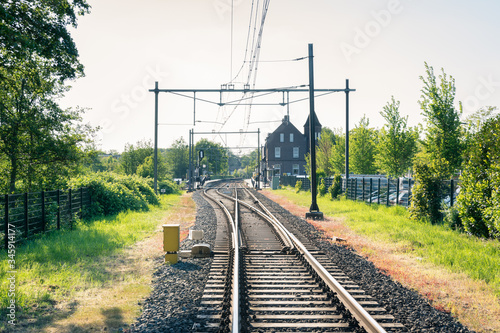 Railroad leading to the station of Bodegraven, the Netherlands photo