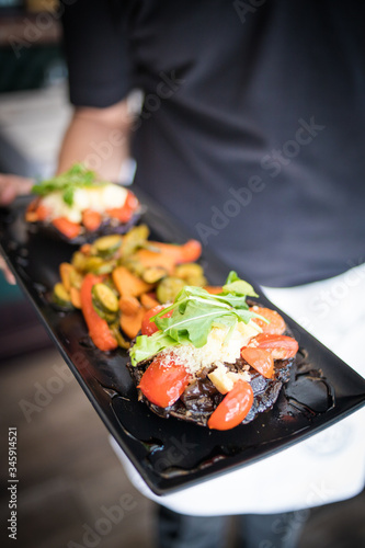 Close up image of gourmet grilled mushrooms being served in a gourmet restaurant