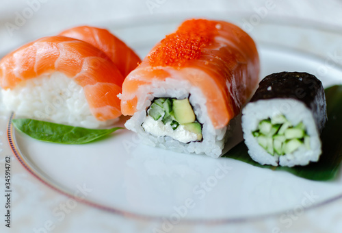 rolls and sushi on a white background