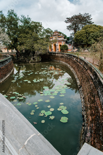 Hue, Vietnam – 27 July 2019: Temple in the Imperial City (citadel) of Hue (UNESCO World Heritage site). The place that leads to the palaces of kings, is the official in the 19th century in Hue, Vietna photo