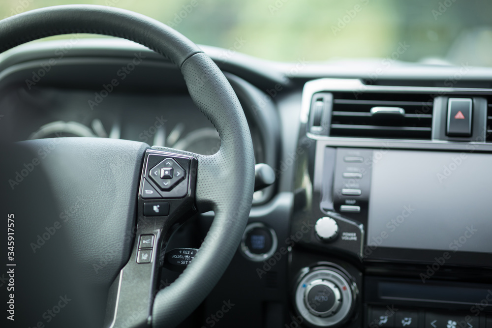 Black steering wheel in luxury car