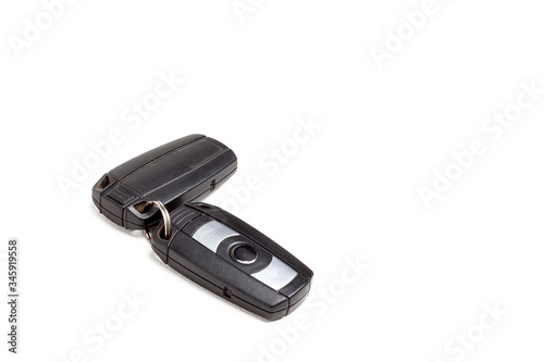 Bild auf Leinwand Car key, a second-hand keychain with a chip and with buttons for opening and closing the central locking control, isolated on a white background in a photo studio