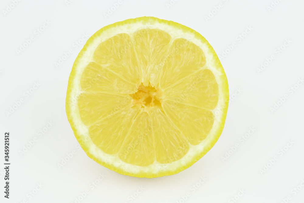 Half of ripe fresh lemon isolated on white background. Yellow fresh sliced lemon separated on white background Half of ripe fresh lemon isolated on white background. Yellow fresh sliced lemon separated on white background
