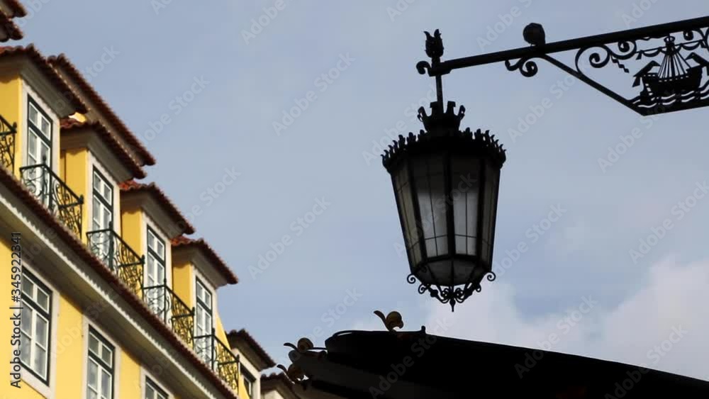 Street lamp and pigeon in the center of Lisbon, Portugal. Street lamp and pigeon in the center of Lisbon, Portugal.