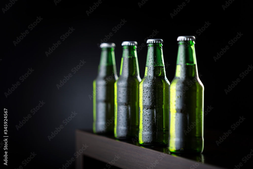 Bottles of cold beer on bar counter