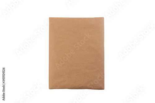 package parcel wrapped in wrapping paper isolated on a white background top view close up