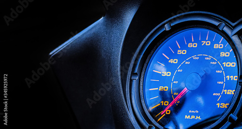 Close-up of the car's speedometer. Copy space. Over speed. Arrow at zero.