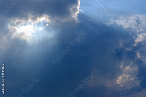 Sunbeam, sunlight through the haze, cloud on the blue sky . Cloud with sun ray.