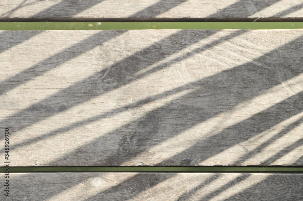 Obraz premium The surface of the wood and the shadow of sunlight for background.