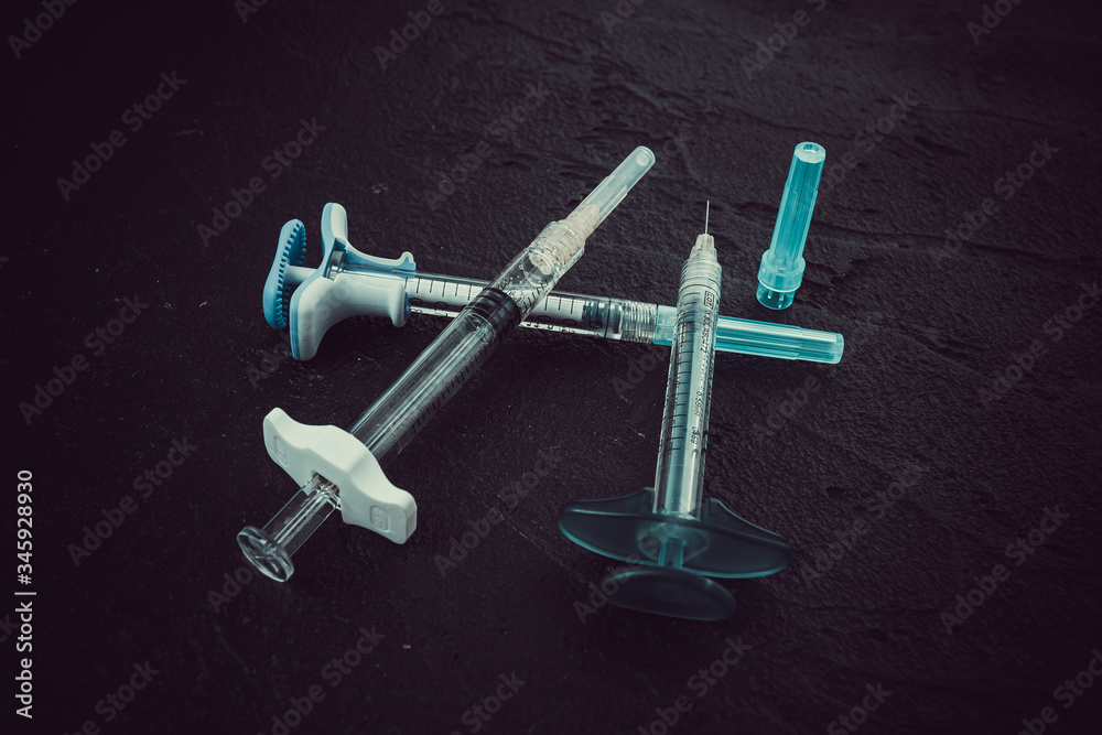A set of different syringes on lack. Face Cosmetics Injecting A set of different syringes on lack. Face Cosmetics Injecting