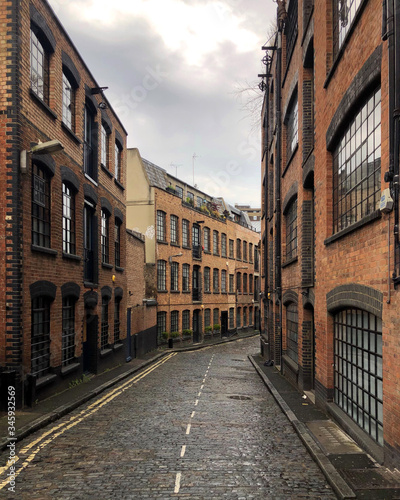Typical street in East London with Victorian warehouses converted into luxury apartments