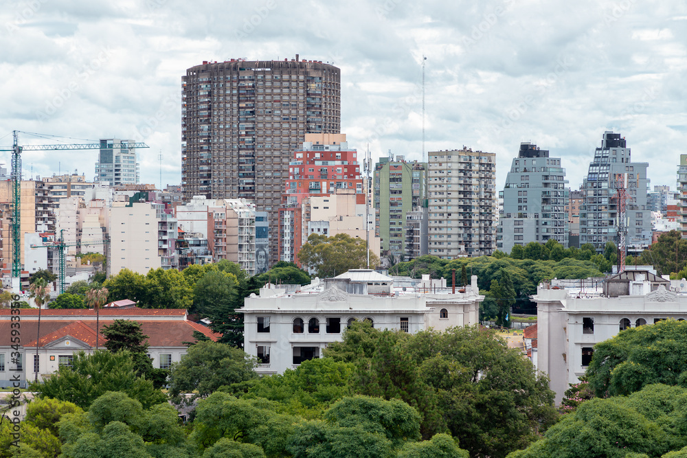 Fototapeta premium Cityscape of Buenos Aires with apartment buildings and trees