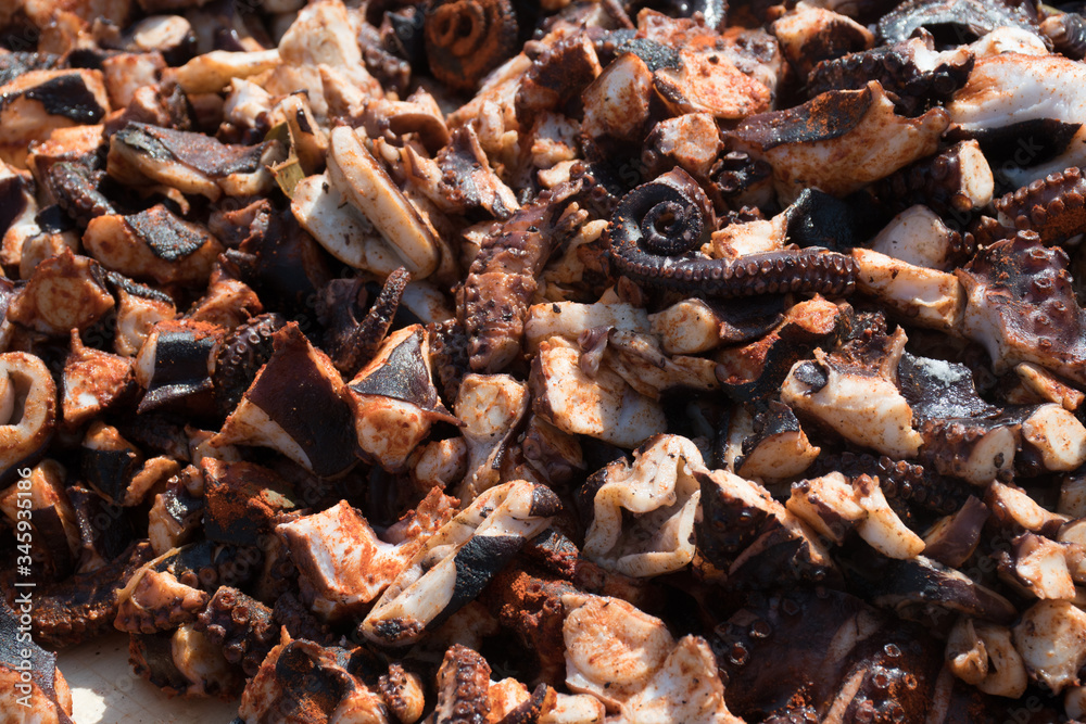 Octopus small chopped bites, street food festival. Seafood festival. Octopus small chopped bites, street food festival. Seafood festival.