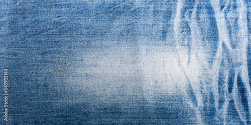 Blue denim jeans texture banner with copy space for text design background. Canvas denim fashion texture. Panoramic fashion banner
