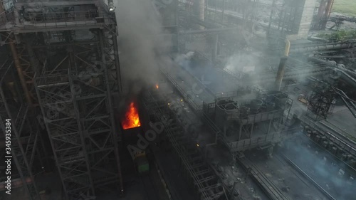 the coke pusher pushes the coke. Coke oven battery. coke and chemicals plant. drone flight over the plant