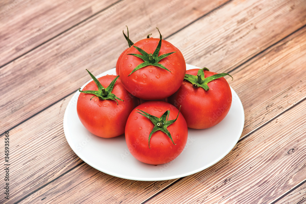 Raw ripe pink heirloom organic tomatoes on wooden background. Vegetarian - Vegan healthy diet culinary
cooking concept - Top View Raw ripe pink heirloom organic tomatoes on wooden background. Vegetarian - Vegan healthy diet culinary
cooking concept - Top View