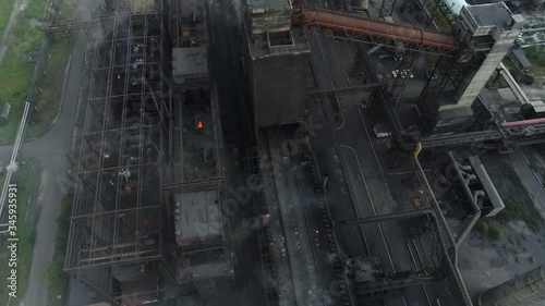 the coke pusher pushes the coke. Coke oven battery. coke and chemicals plant. drone flight over the plant