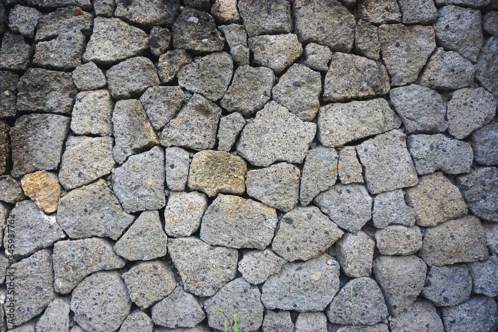 Rough stone mosaic wall with tightly fitted pattern Rough stone mosaic wall with tightly fitted pattern