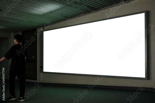 Blank Billboard Banner Light box in Subway station with blurred people Travel.