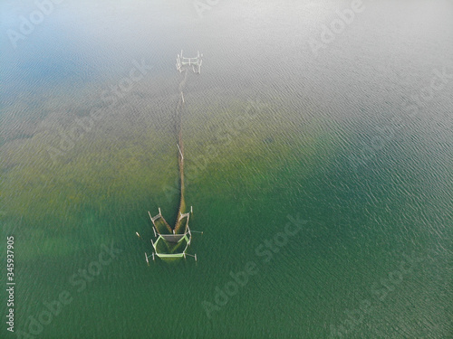 Aerial top shot of weirs, fishing net at lake Krüselinsee, Mecklenburg Vorpommern photo