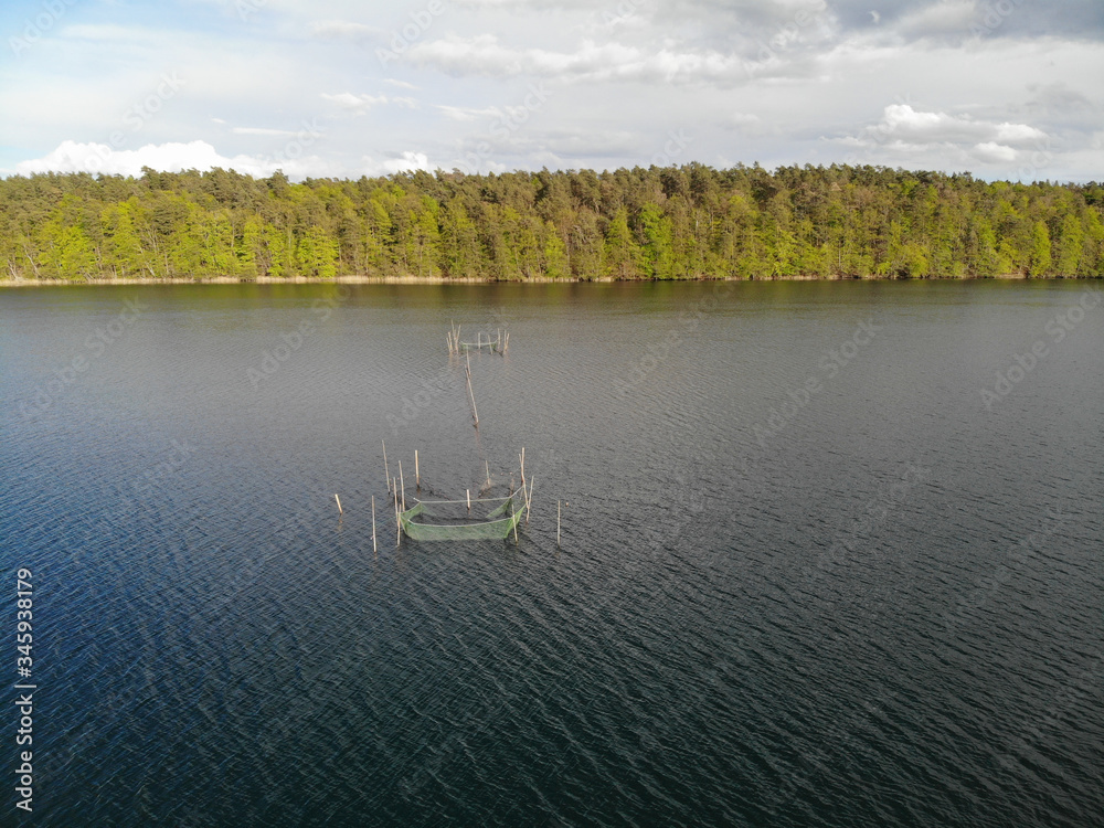 Aerial view of fishing nets, weirs at lake Krüselinsee