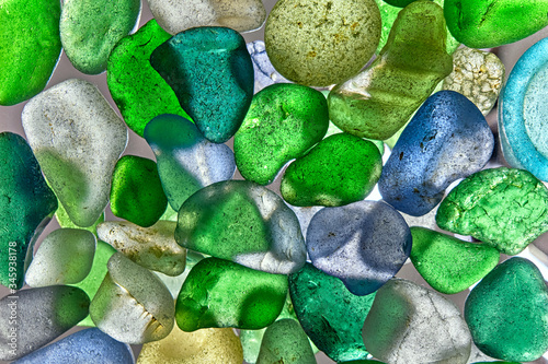glass pieces polished by the sea isolated on transparent background. Abstract pattern with colored sea glass.