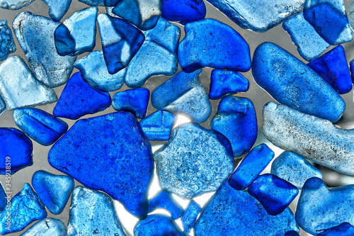 glass pieces polished by the sea isolated on transparent background. Abstract pattern with colored sea glass.