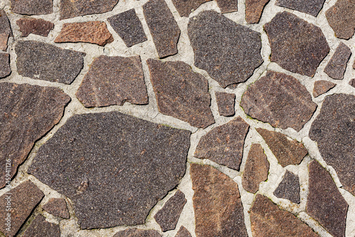 Close-up of an outdoor flooring made with irregular porphyry slabs, full frame, Italy, Europe