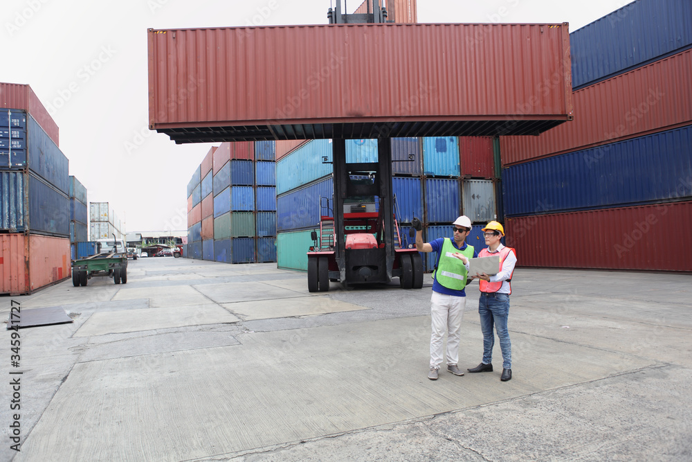Engineering group working and they are loading container for support logistics and import export business Engineering group working and they are loading container for support logistics and import export business