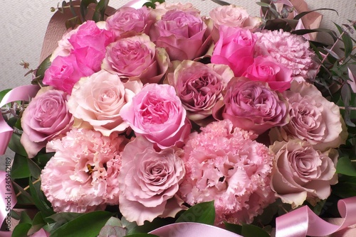                                                        - Pink roses in flower arrangement
