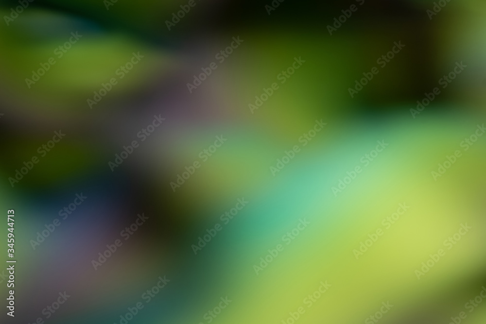 abstract background of multiple gradients and blended colors in shades of green, blue, purple, and dark grey