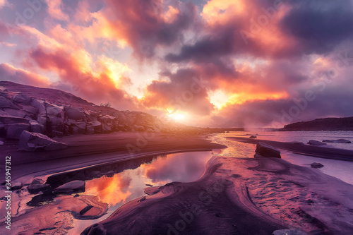 Picturesque landscape in Iceland during sunset. Tipical Icelandic scenery on river with colorful sky. Gorgeous summer sunrise in Jokulsargljufur National Park. Iconic location for photographers