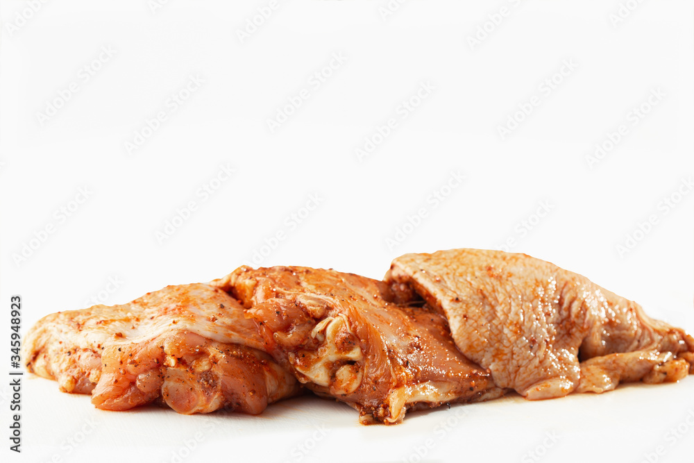 Free range Boneless chicken thighs on stone table. Raw chicken marinated thigh . The view from the Top. Food Background. Copy space. Cooking content. Meat shop.