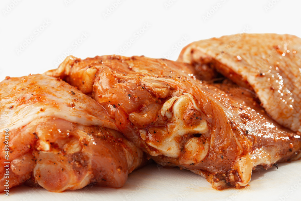 Free range Boneless chicken thighs on stone table. Raw chicken marinated thigh . The view from the Top. Food Background. Copy space. Cooking content. Meat shop. Free range Boneless chicken thighs on stone table. Raw chicken marinated thigh . The view from the Top. Food Background. Copy space. Cooking content. Meat shop.