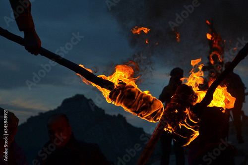 Detail of the flames of burning torches at the Nowruz   Novruz celebration near the city of Akre in Kurdish Iraq  a local tradition  men carry burning torches to the top of the mountains.