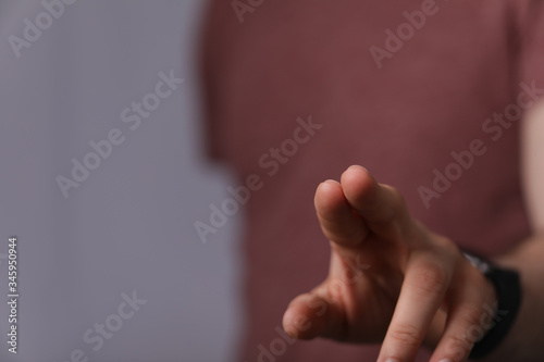 A man hand touching virtual screen, modern background concept , can put your text at the finger, copy space.