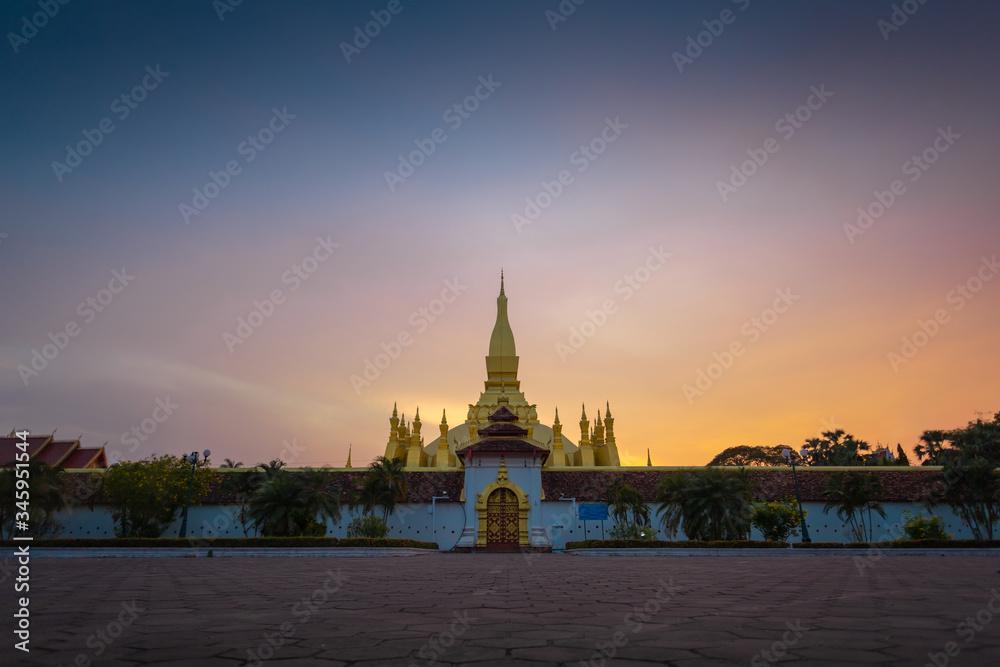Fototapeta premium Thatluang is the most beautiful culture and icon of Vientiane Laos. Thatluang at sunset