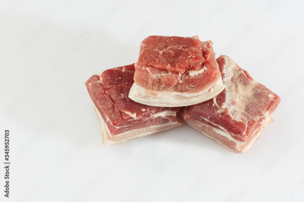 Fototapeta premium Pork belly isolated on white background. Top view. fresh ribs isolated on white background. With clipping path. Raw meat, farm and cooking concept. Meat shop.