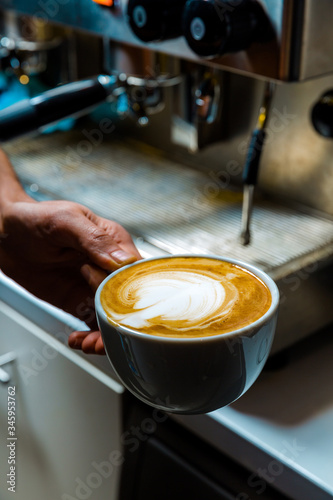 Preparing latte with an espresso machine