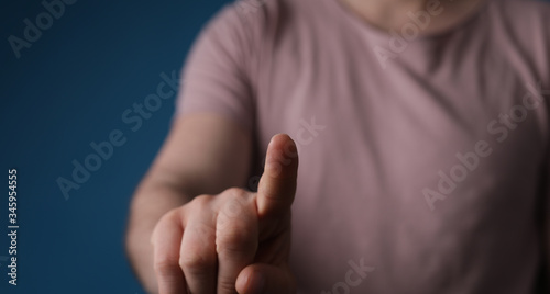 A man hand touching virtual screen, modern background concept , can put your text at the finger, copy space.