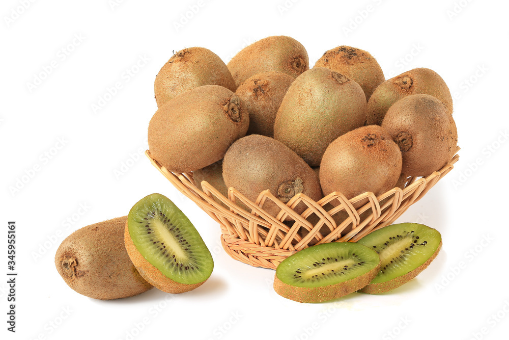 Delicious kiwi in wicker basket with half and slices isolated on white Delicious kiwi in wicker basket with half and slices isolated on white