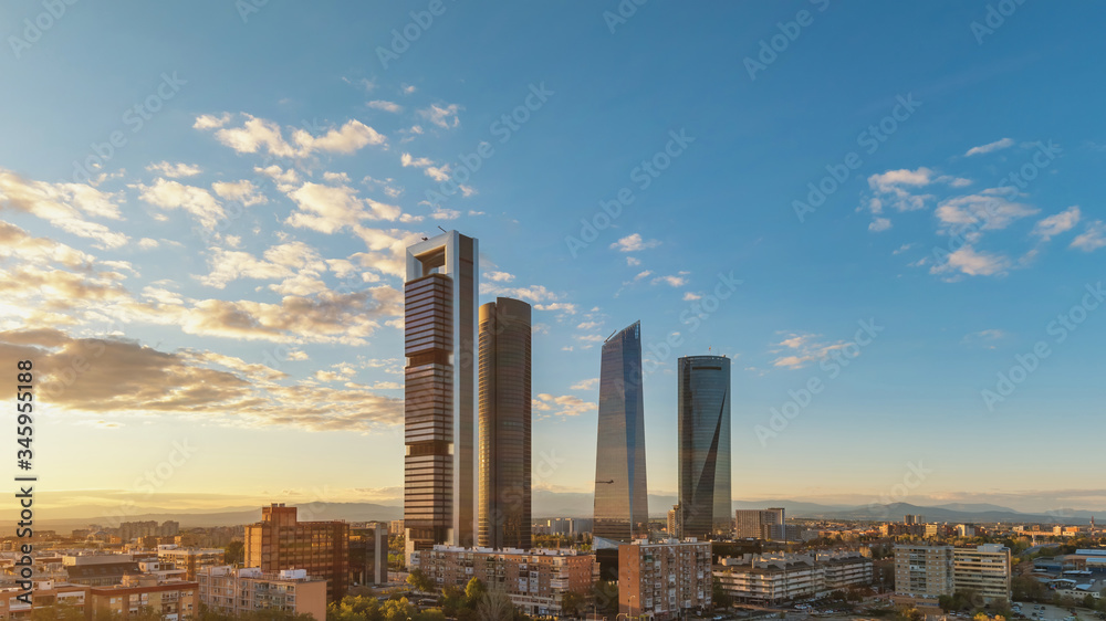 Madrid Spain, sunset city skyline at financial district center with four towers