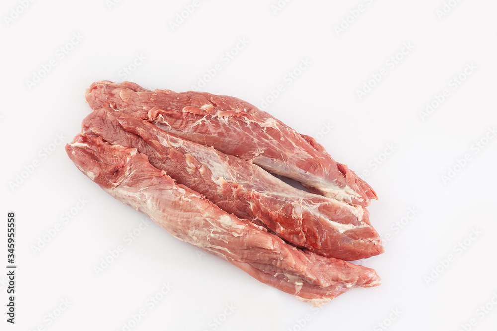 slices loin on a white background. Raw pork . Advertising for meat shop and farm. Various kinds of meat and ready to cook concept. Top view. Space for text