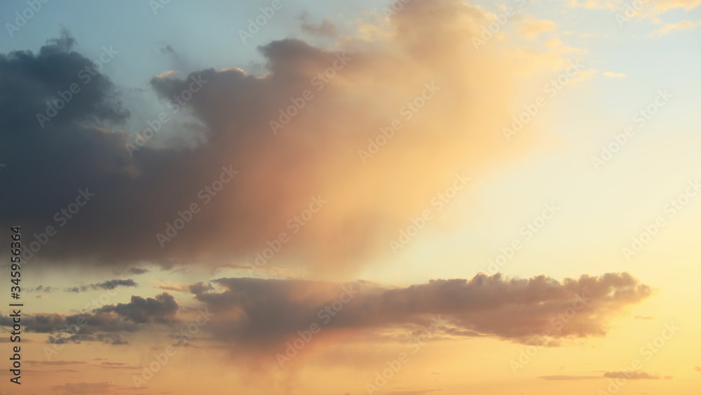 Sunset Sky. Bright Dramatic Sky With Fluffy Clouds. Yellow, Orange Colors. Dawn Sky