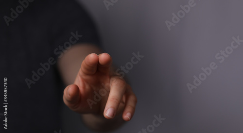 A man hand touching virtual screen, modern background concept , can put your text at the finger, copy space.